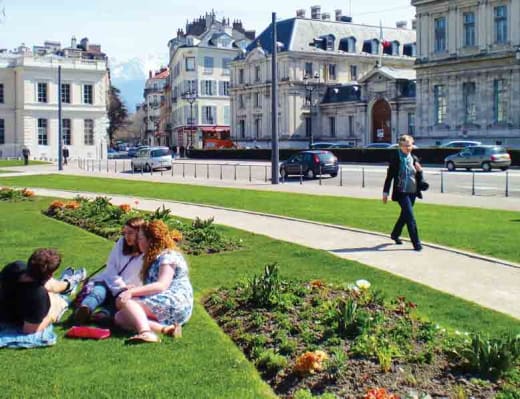 Students resting in a garden in Grenoble, France.