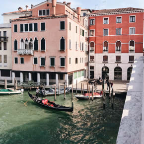 Pinik buildings and gondolas in Italy.