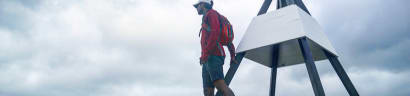 A student looking at a view of the ocean.